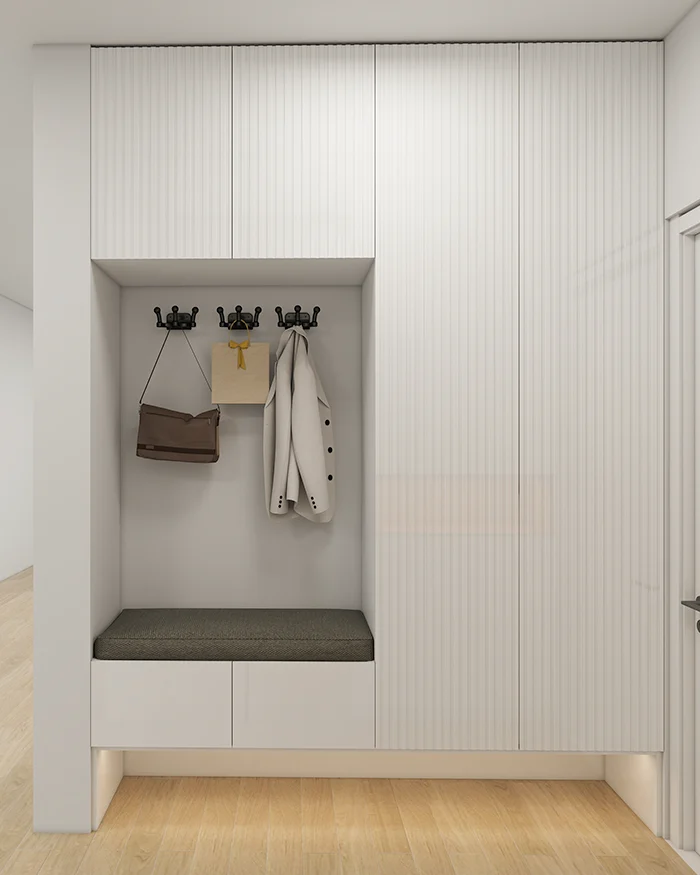 Custom entryway in Kosmaj with upholstered bench and coat-hook niche.