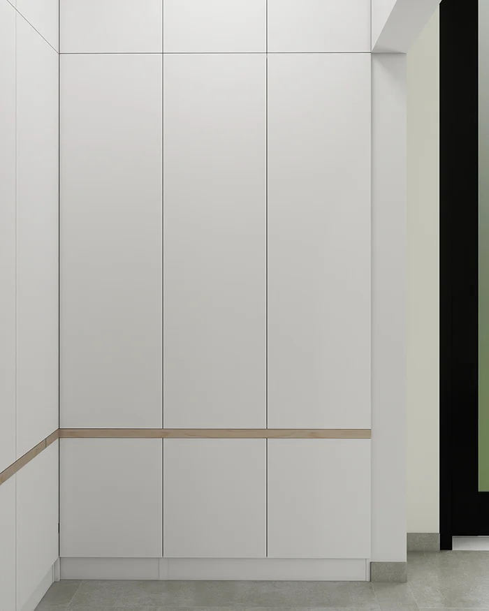 Minimalist custom hallway wardrobe with white fronts, lower cabinets and a horizontal wood detail